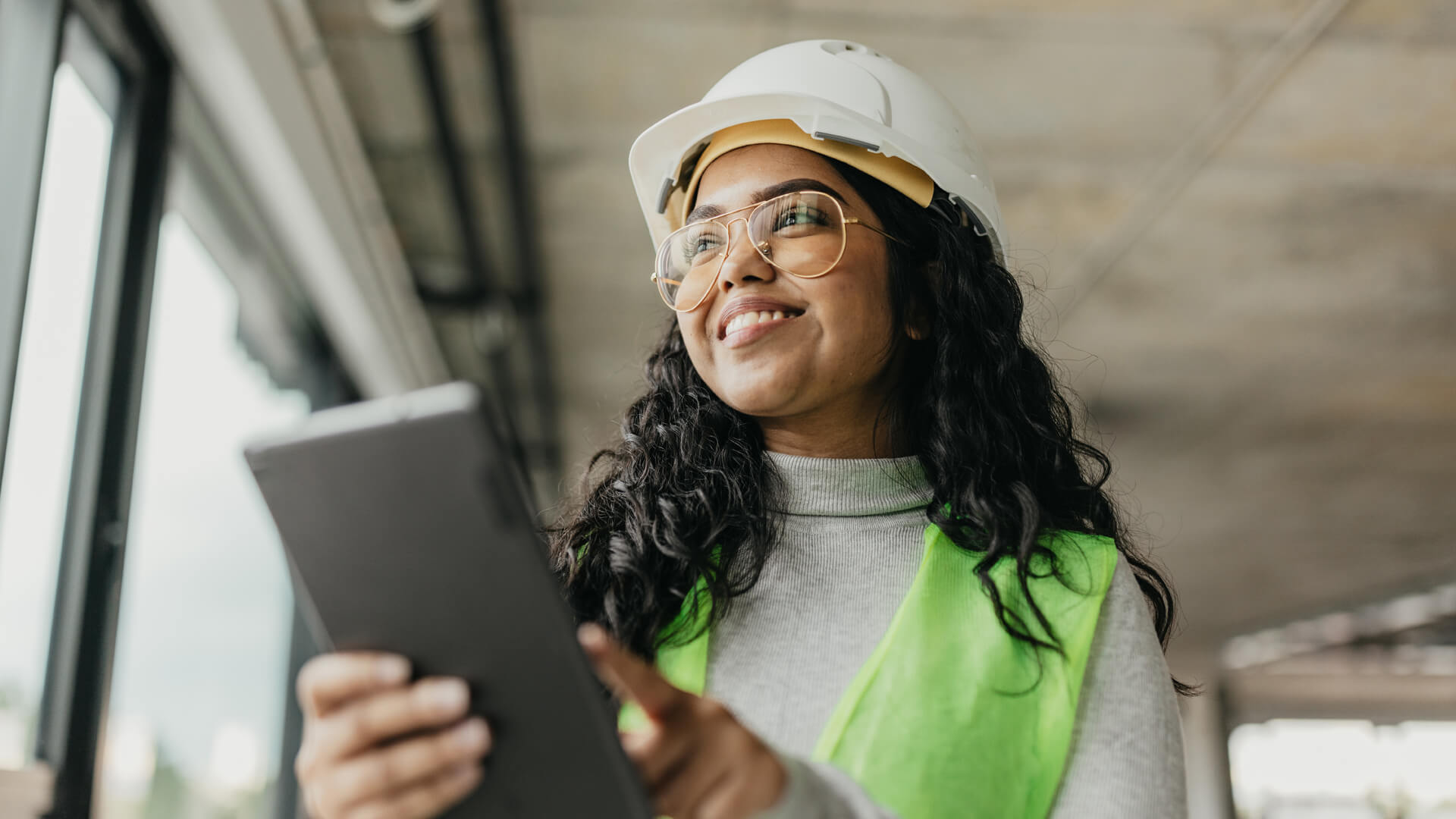 Female construction inspector working on a project specialized in engineering and construction.