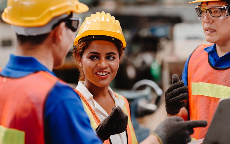 Male and female construction workers onsite