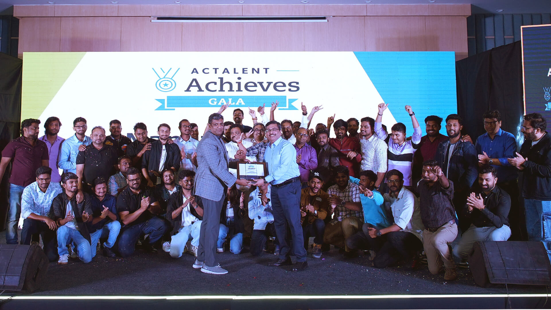 large group on stage at Actalent Achieves Gala 2025